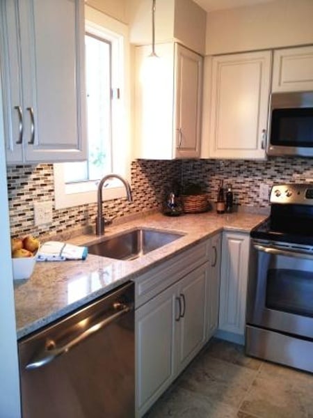 Cream painted cabinets with brown glaze.