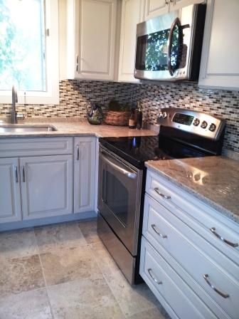 Full overlay cream painted kitchen cabinetry