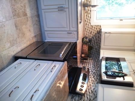 Full overlay cream painted kitchen cabinetry