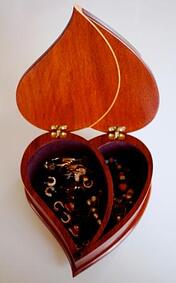 Paduak jewelry box with maple inlay open 
