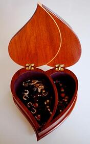 Paduak jewelry box with maple inlay open