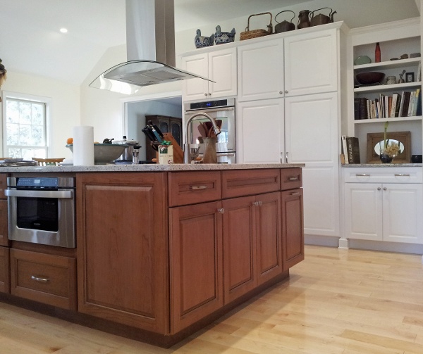 Beautiful stained full overlay Island cabinetry mixed with painted perimeter cabinetry