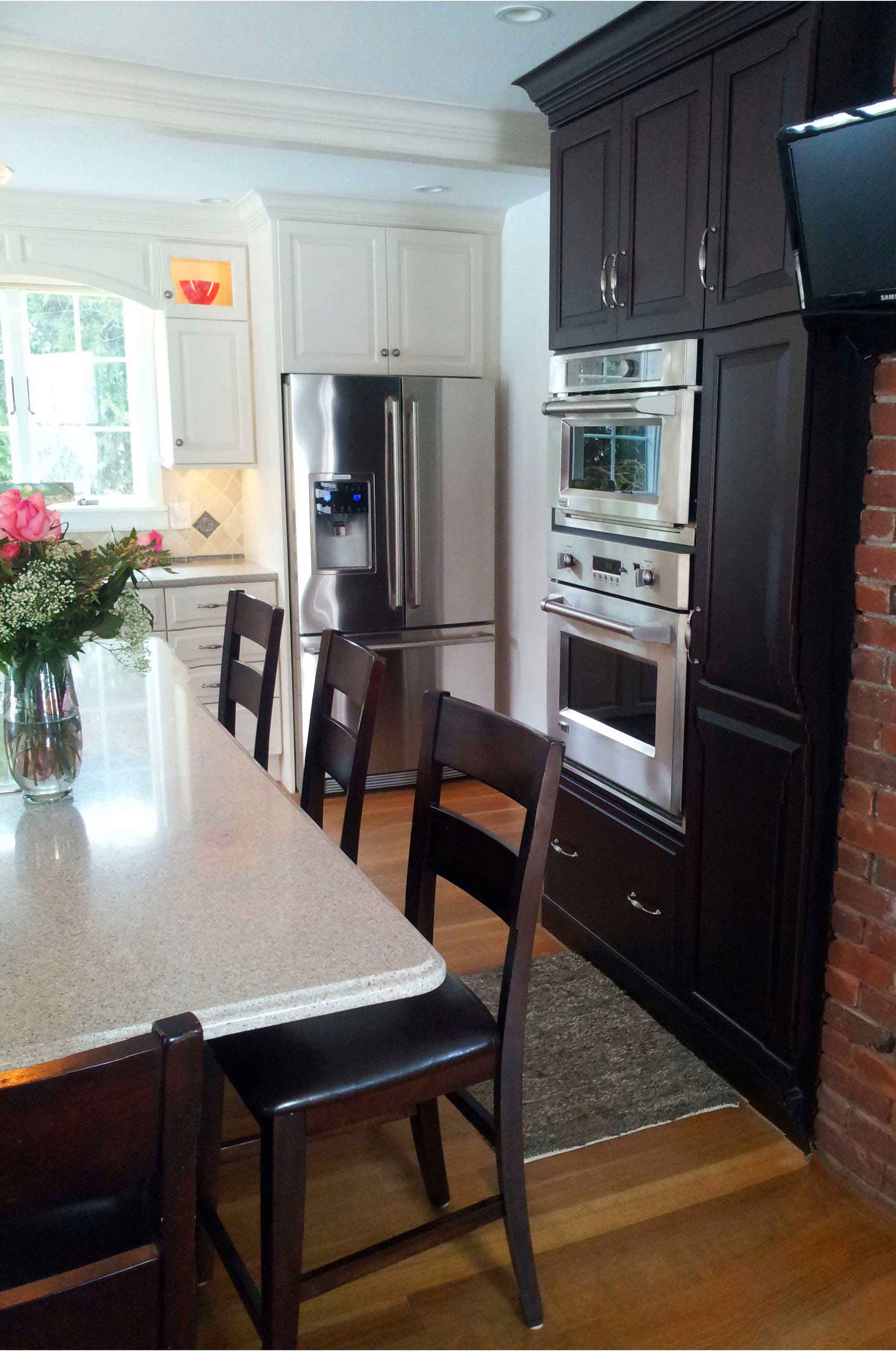 Beautiful dark stained cabinetry paired with classic white