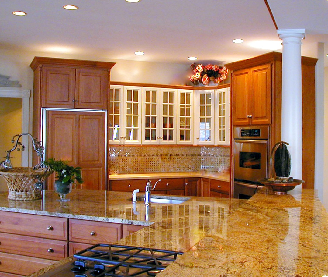 traditional kitchen with warm wood upper and lower cabinets