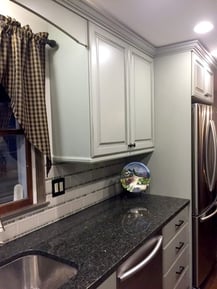 traditional white wood cabinets and black granite counter tops