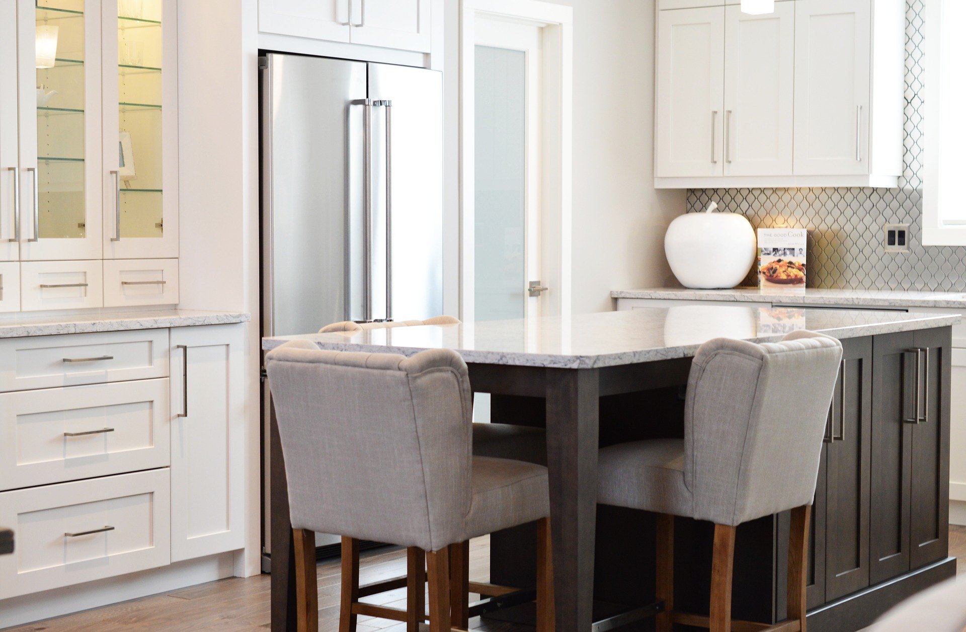 crisp white cabinetry and dark wood island are a beautiful combo