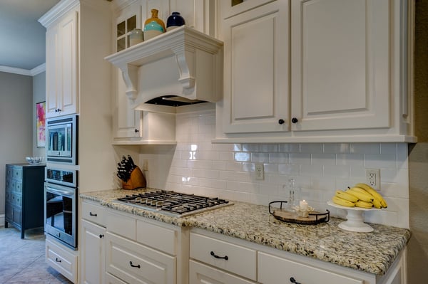 custom wood vent hood with molding is an elegant feature