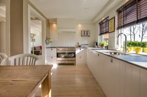 warm traditional kitchen with simple white cabinetry and minimal accents